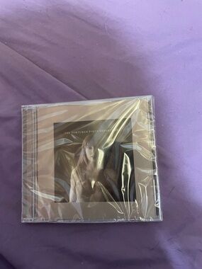 Taylor Swift CD with Beige and Black Artwork